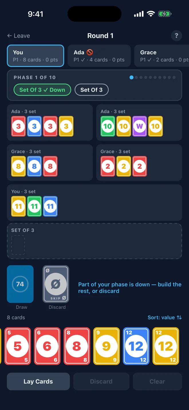 A game in progress with part of a phase laid down and groups from every player on the table.